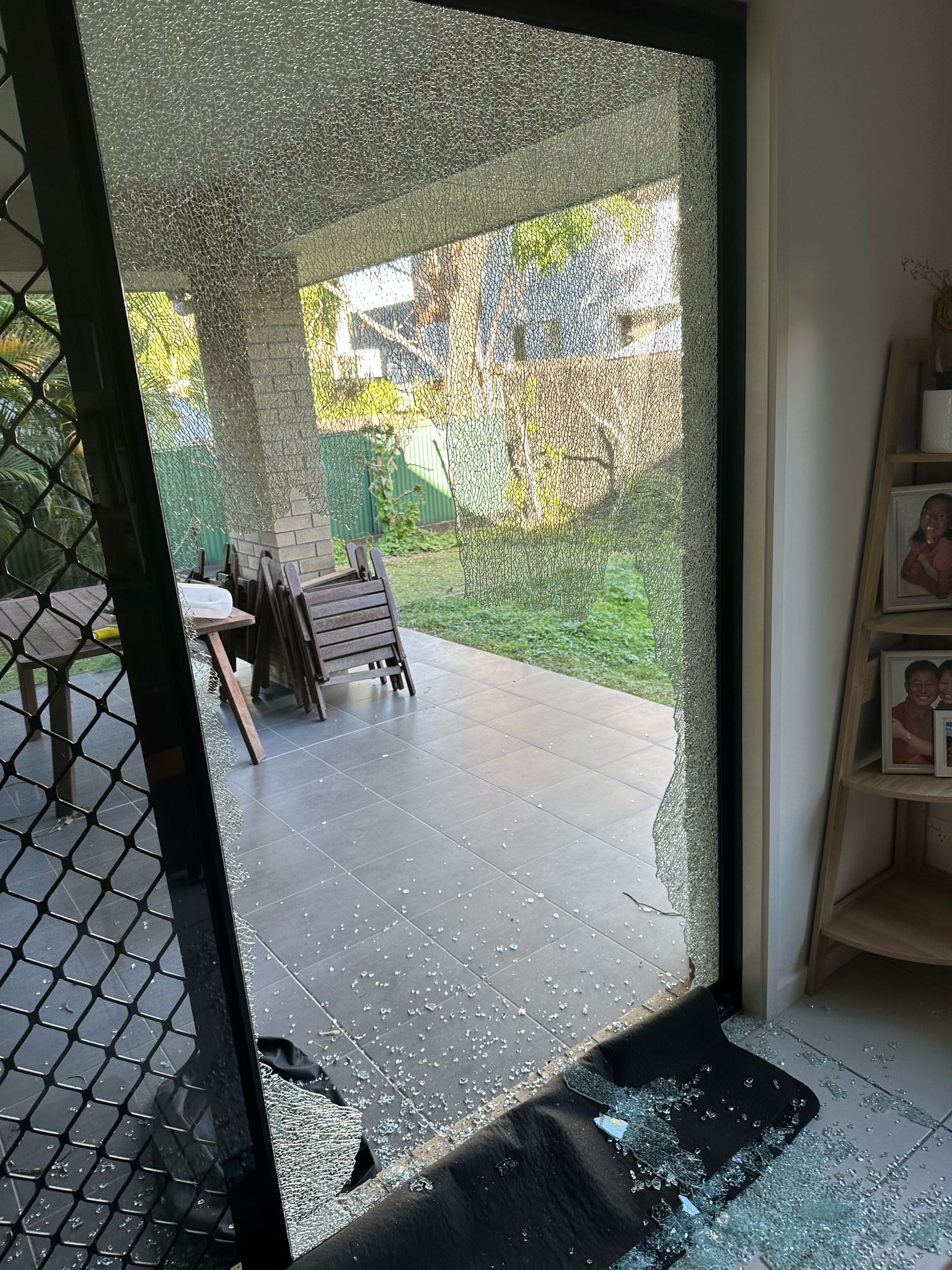 Before: shattered sliding door glass